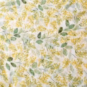 Detailed macro view of yellow floral print on lightweight white linen feel scarf fabric