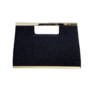 Elegant navy blue glitter clutch bag with gold metal trim and cutout handle for formal events