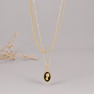 Baroque style double layered necklace with black enamel pendant and Queen portrait relief