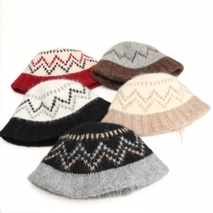 Detail shot of winter diamond lattice knitted bucket hats in five stylish color options