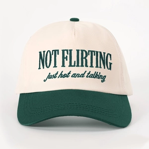 Retro baseball cap with NOT FLIRTING embroidery and green brim in cream finish