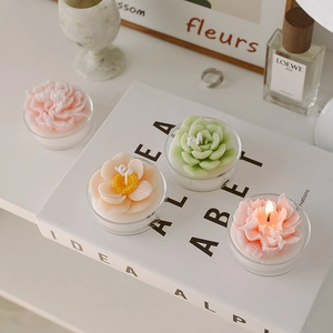 Handmade succulent shaped scented tea light candles in pink orange and green colors