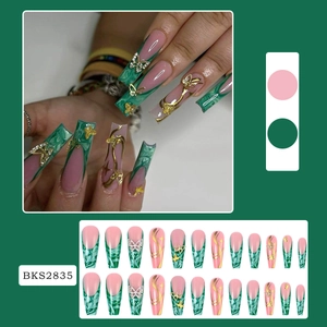 Detailed set of long coffin press-on nails with pink green marble and golden butterfly