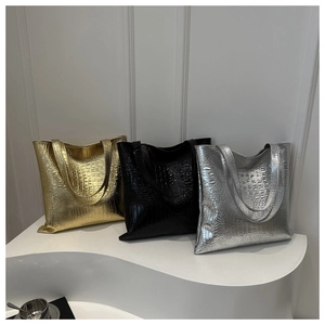 Detailed comparison of gold, black and silver crocodile-embossed tote bags for women