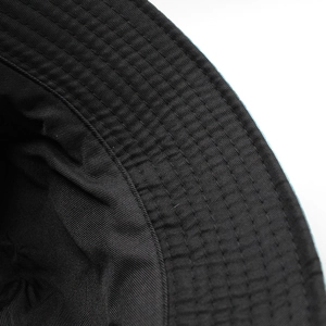 Double-sided tie-dye bucket hat in black cotton fabric with reinforced brim stitching