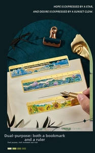 Close-up of brass 10cm ruler bookmarks featuring impressionist oil painting designs