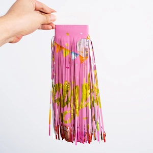 Pink fringe banner with gold Happy Birthday text and hanging hooks for party decor