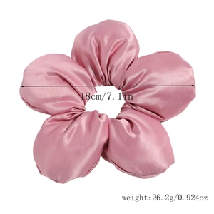 Detail showing the 18cm pink satin oversized flower scrunchie with size specifications