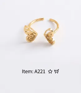 Macro shot of gold butterfly wing adjustable ring with detailed metallic texture