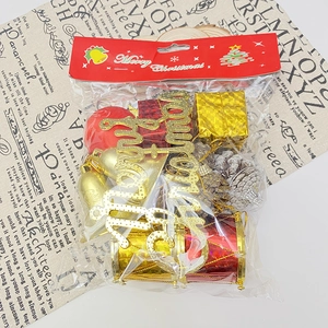 Christmas tree decoration set with gold and red bells, pine cones and mini gift boxes