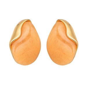 Detail of chunky gold irregular earrings with vibrant orange resin waterdrop inlay