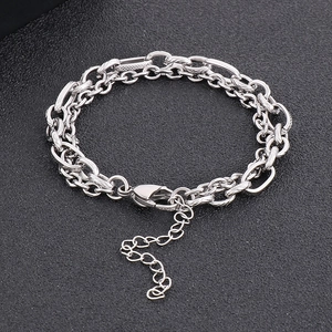 Macro detail of silver double-layered titanium steel chain bracelet with lobster clasp