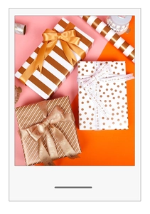 Detail of gold foil gift wrapping paper with stripes, dots, and Eternal Love ribbons