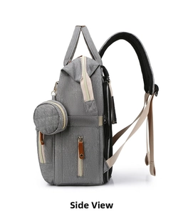 Side view of gray portable diaper bag with detachable round coin purse and mesh straps