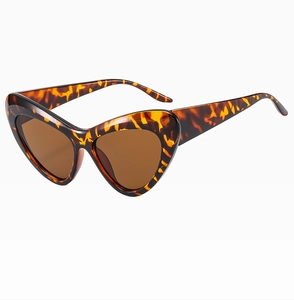 Side view of tortoise shell cat-eye sunglasses with UV400 protective brown lenses
