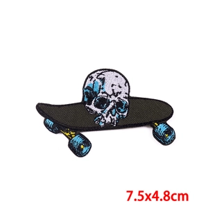Detail of 7.5x4.8cm skateboard skull embroidered patch with intricate stitching