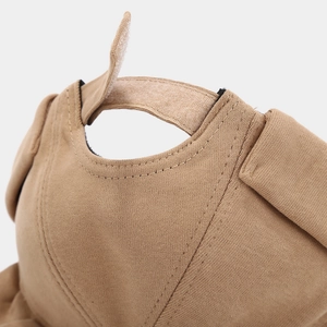 Detailed close-up of khaki docker hat showing adjustable velcro strap and cotton texture