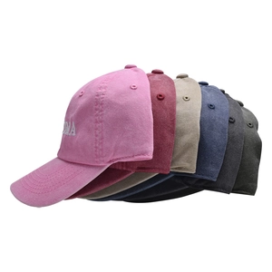 Detailed side view of six washed cotton baseball caps with GRANDMA embroidery text