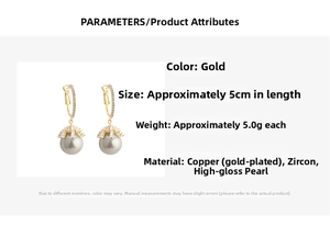 Detail view of 5cm gold drop earrings featuring gray pearls and zircon inlay parameters