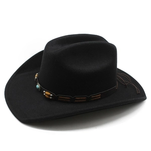 Detail of black wool felt cowboy hat with turquoise bead and wood ornaments on band