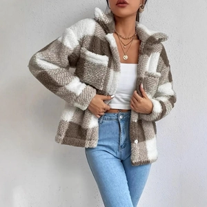 Close-up of brown and white checkered plush jacket showing soft fuzzy fabric texture