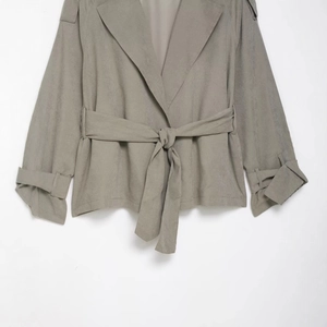 Neutral grey women's lapel cropped trench coat with waist tie and adjustable cuffs