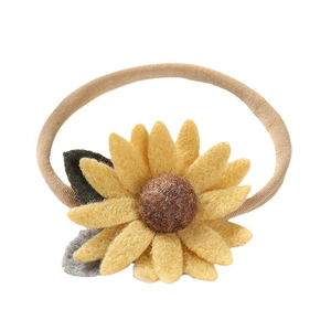 Handmade sunflower nylon baby headband with yellow felt petals and elastic soft band