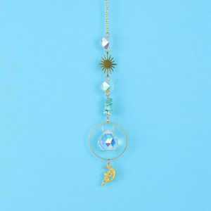 Detail of golden sun and moon精灵 crystal suncatcher with blue gravel and faceted glass ball