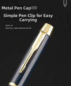 Macro detail of navy blue business pen featuring a gold arrow-shaped metal clip