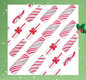 Detail of long square Christmas press-on nails with red bows and candy cane stripes