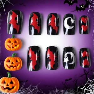 Halloween press-on nails set featuring dark bat, moon, and heart designs on black base