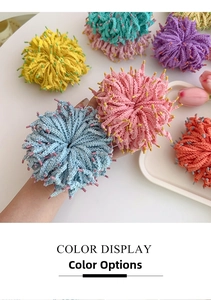 Detail of colorful knitted fringe elastic hair bands with soft textured pom-pom design