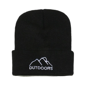Detail of black knitted beanie featuring white mountain embroidery and Outdoors text