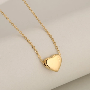 Elegant gold heart pendant necklace with polished stainless steel mirror finish for women