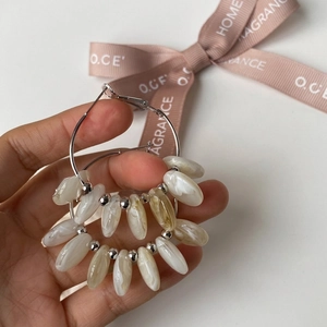 Silver geometric hoop earrings with marble textured teardrop charms in boho style