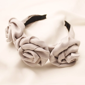 Elegant satin headband with three 3D rose flowers in champagne silk fabric