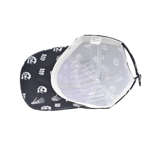 Detail shot of Halloween skull baseball cap interior showing white mesh lining and wash label