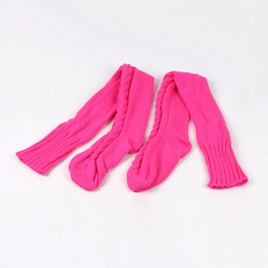 Detail of pink cable knit over-knee socks showing soft textured woolen yarn patterns