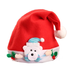 Close-up of a plush red Christmas hat with a cute 3D teddy bear and holly leaf details