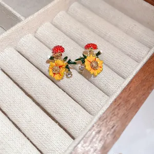 Sweet floral silver needle stud earrings with orange petals and sparkling rhinestones