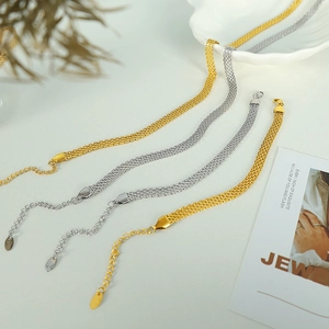Flat gold and silver woven mesh necklaces and bracelets set in minimalist style
