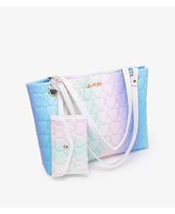 Detail of heart quilted gradient tote bag with matching mini coin purse and gold lettering