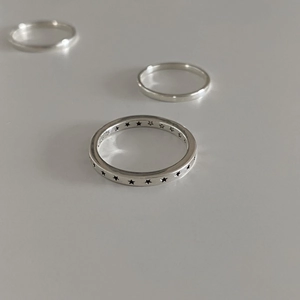 Minimalist S925 sterling silver ring set featuring a hollow star pattern band in silver