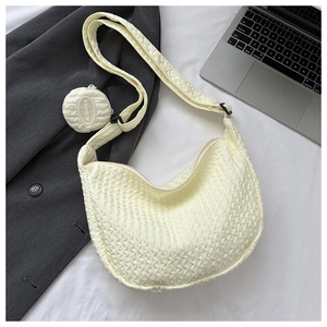 Detailed macro view of the cream bubble textured nylon shoulder bag with a round mini pouch
