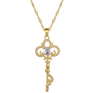 Elegant gold titanium necklace with a luxury crystal-encrusted key pendant on white background