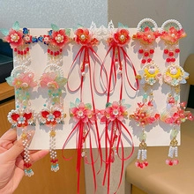 Close-up of red and pink floral tassel hair clips set for traditional Chinese Hanfu