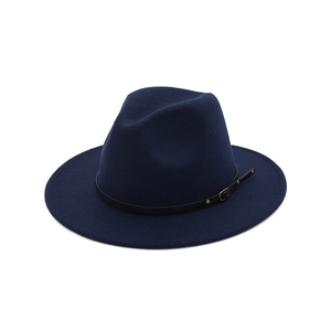 Detail of navy blue wool fedora hat featuring a slim black leather band and gold buckle