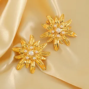 Exquisite 18K gold plated flower earrings with pearls on champagne silk fabric
