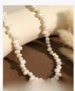 Close-up of high-luster cream white natural freshwater pearl necklace on a display stand
