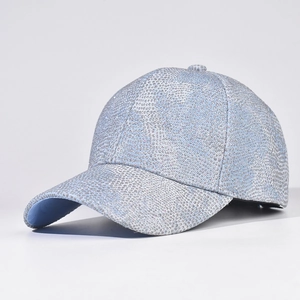 Close-up of sparkling blue rhinestones and metallic finish on a baseball cap detail